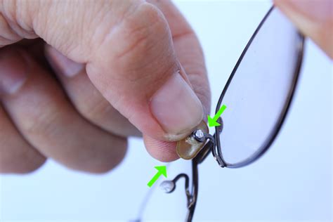 replacing nose pads on eyeglasses.